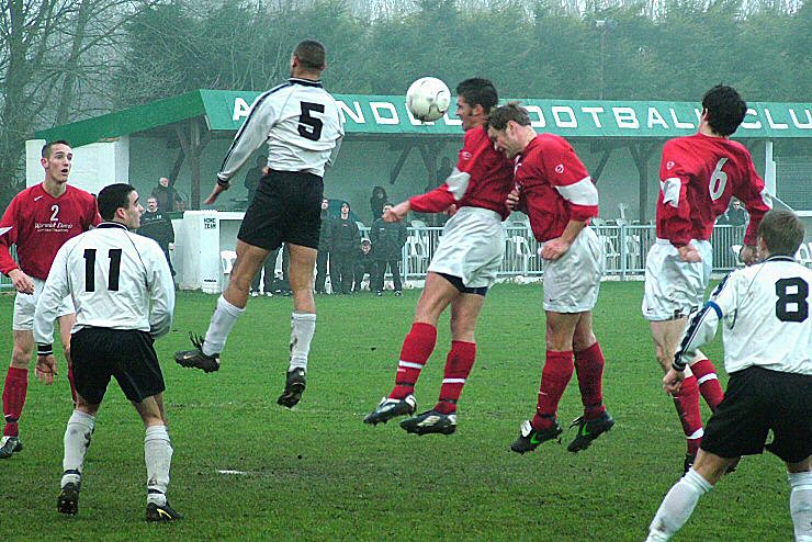 Jason Wimbleton, Barry Pidgeon and Kevin Bush Arundel all go for the header with David Stares (5) with Jon Ducker (11) and Justin Jones (8) close up
