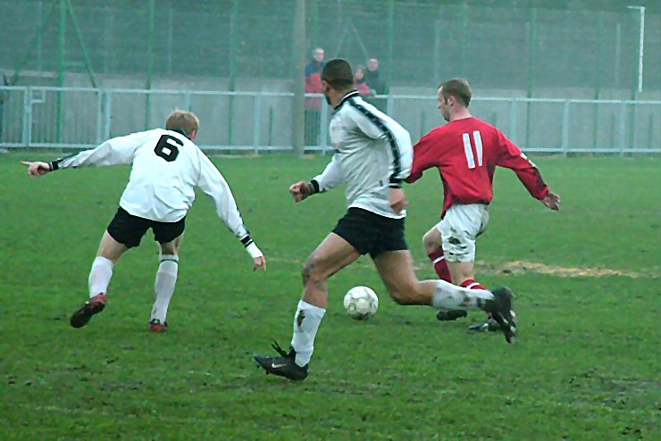 Rob Grove (11) tracked by Stuart Channon (6) and David Stares
