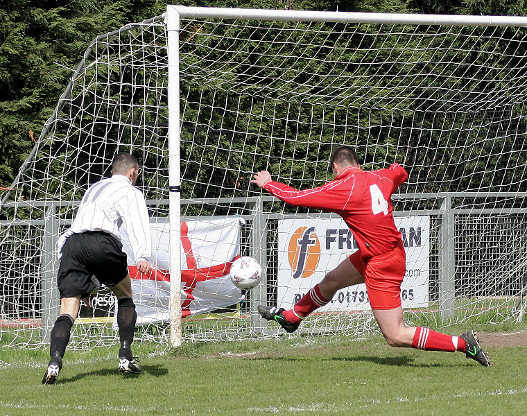 An important early clearance by Danny Vant with Phil Churchill rushing in
