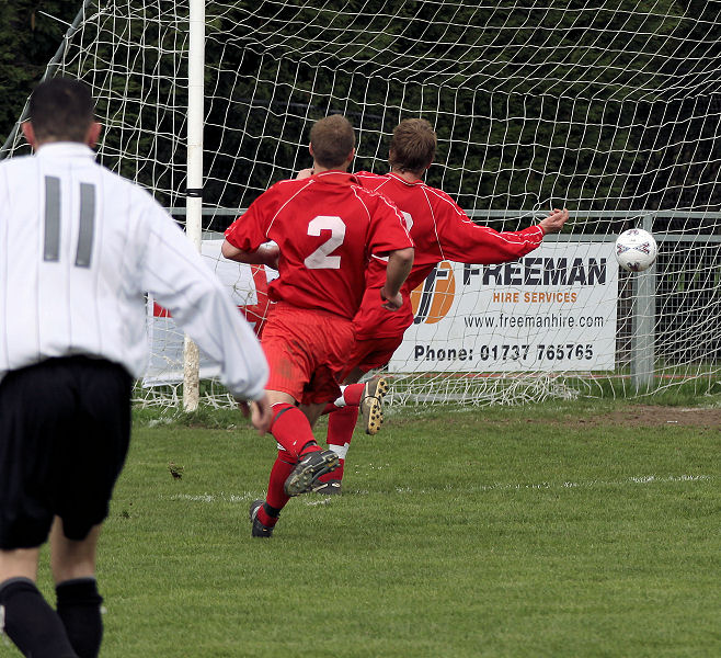 Josh Biggs (hidden by Phil Churchill) levels it up at 1-1 to swing the balance in favour of East Preston
