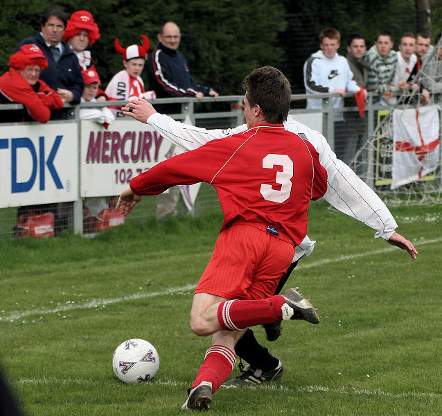 Jamie Sinclair tackles Chris Yelling 
