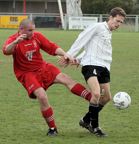 Luke Jones tries to get the ball from Chris Yelling
