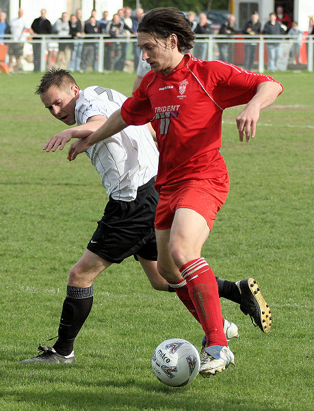 Stephen Gillett goes round Seb Keet for a late Redhill attempt but it finishes 2-1 to East Preston
