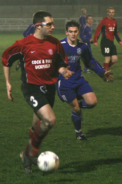 Andy Kerr on the ball with Craig Cox moving in 
