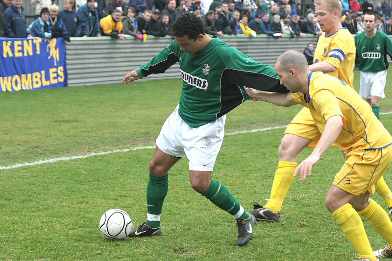 Ryan Gray and Steve Butler try and win the ball from Wes Harrison
