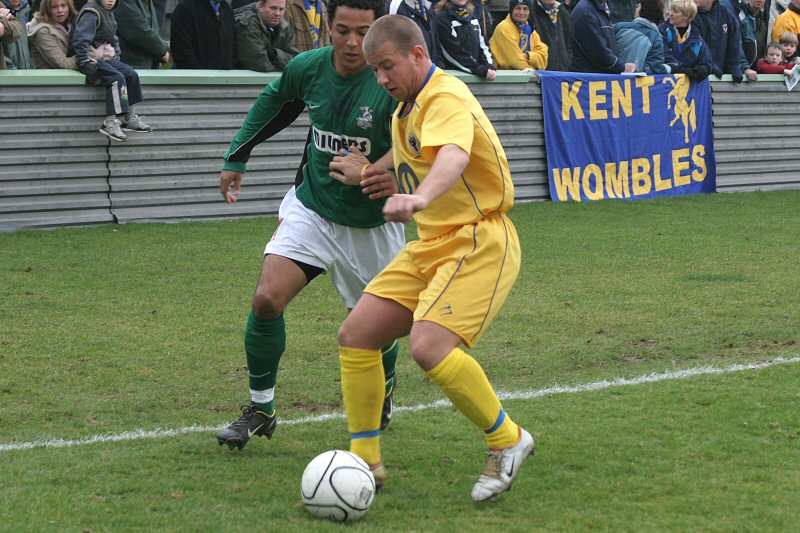 Mark Jones shields the ball from Wes Harrison
