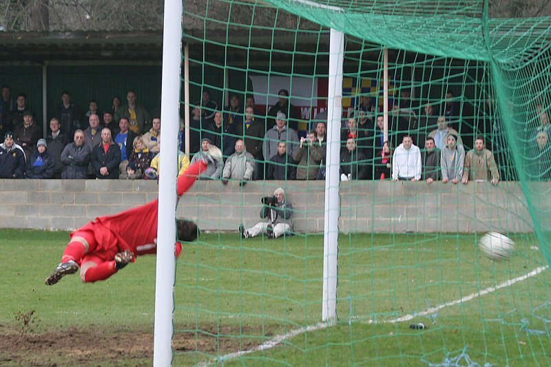 Paul Smith attempts to  reach Steve Sargent's free kick which was curled over the wall for the opening goal
