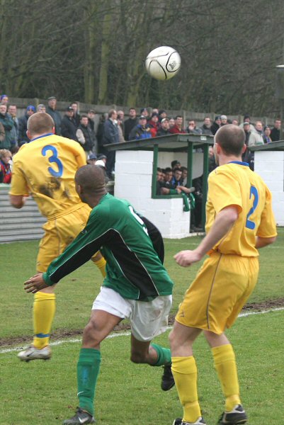 Mark Jones beats Marc Charles-Smith to the header with Mark Cooper close by
