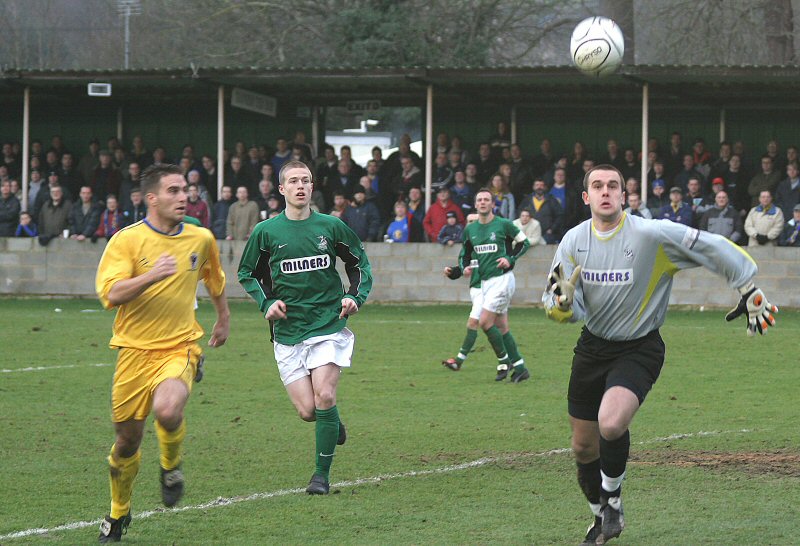 Chris Gell and Tommy Dunn race for the ball
