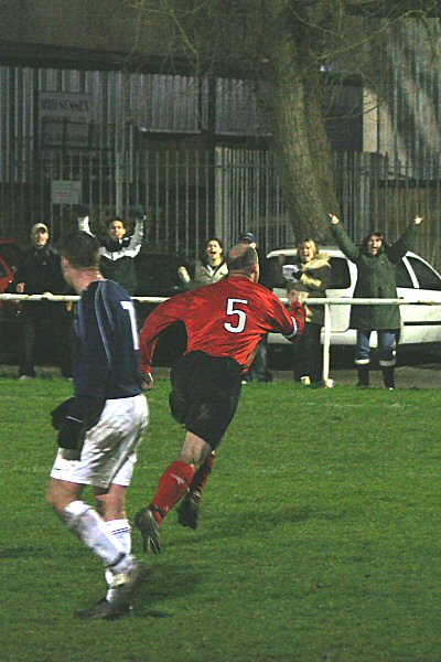 Tony Miles celebrates his equaliser with some of the Wick fans
