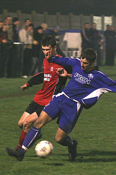 Sean Duffy wins the ball from Matt Michaels
