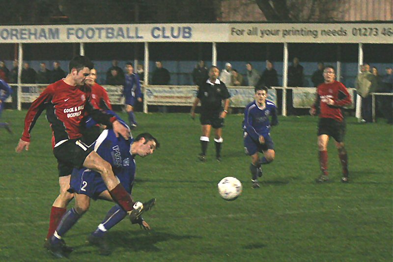 Sean Duffy goes down in the box from a challenge by Matt Michaels...
