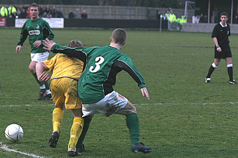 Richard Butler is tackled by Dean Carpenter
