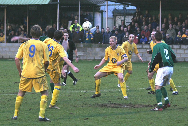 Dante Alighieri (hidden) intercepts the ball between Rob Ursell and Steve Butler
