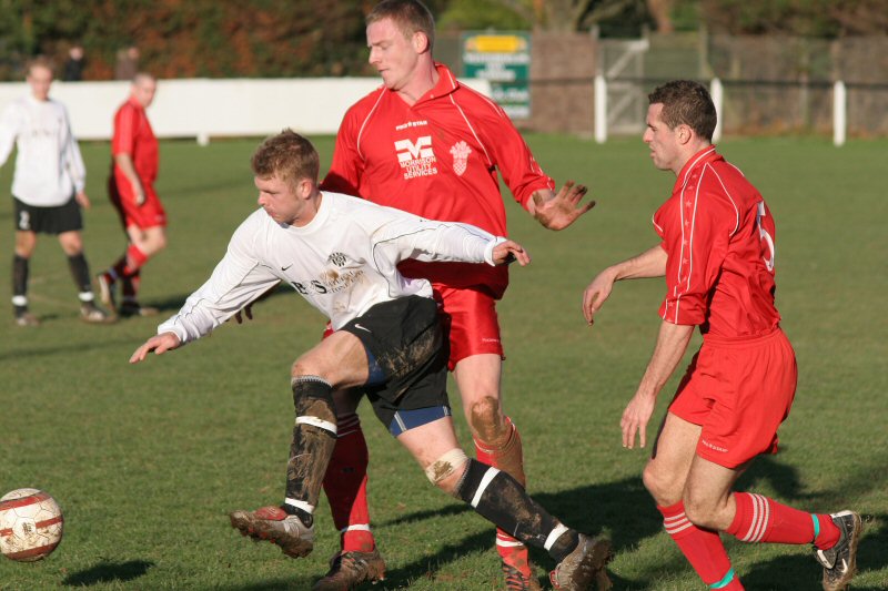 Lee Farrell rides the challenge of Geoff Clark and Tim Smith
