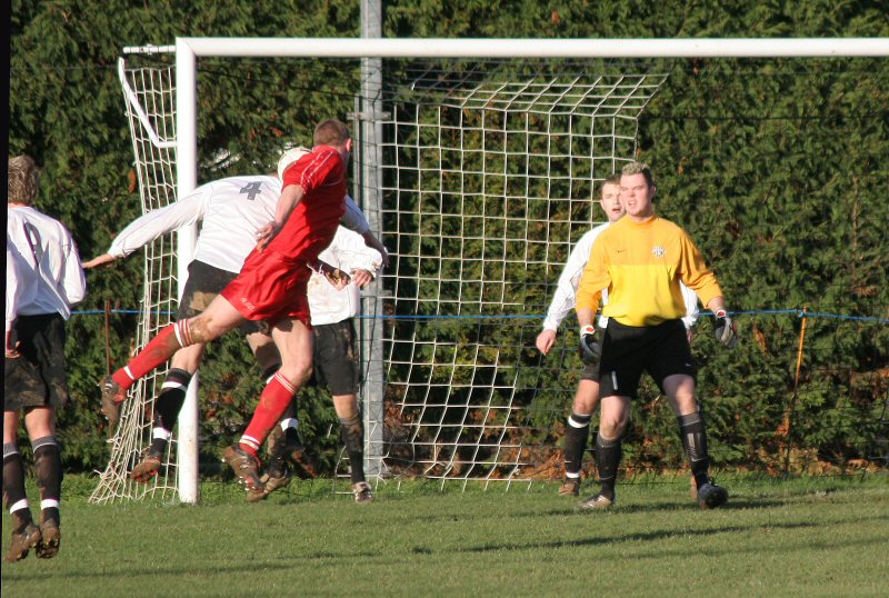 Gavin Hammond beats Geoff Clark to get in a vital header for East Preston
