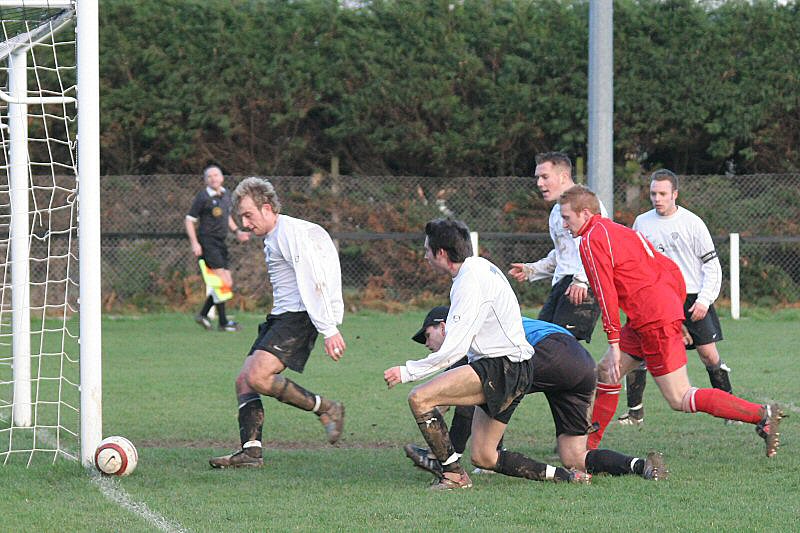 ...Josh Biggs stops the ball by the post...
