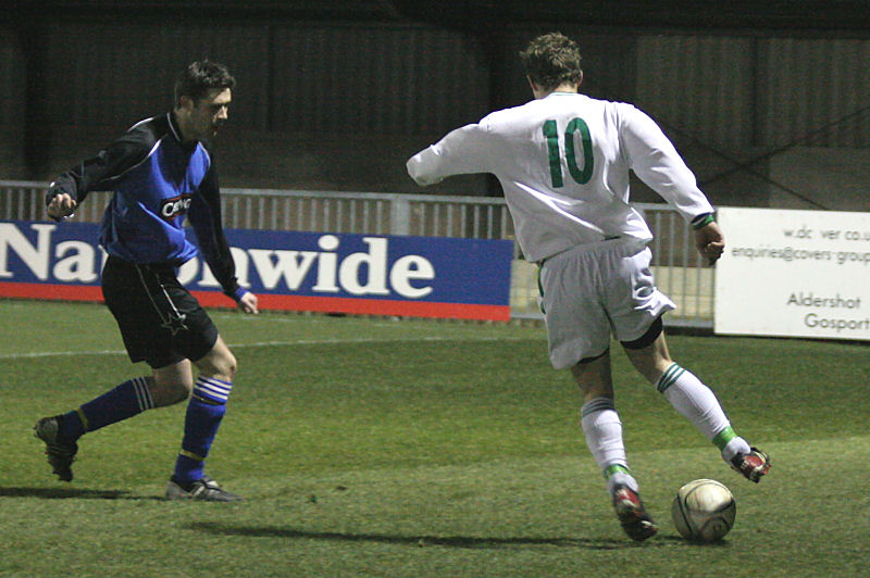 Neil Murfin goes past a defender
