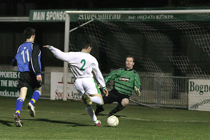 Russell Hardwell's attempt on goal is saved by Stuart Burt

