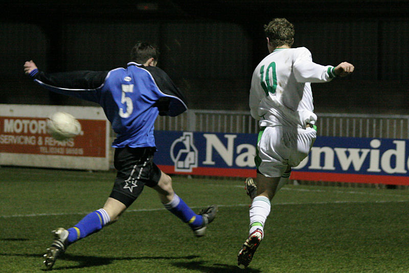 Neil Murfin beats Martin May to get a cross in
