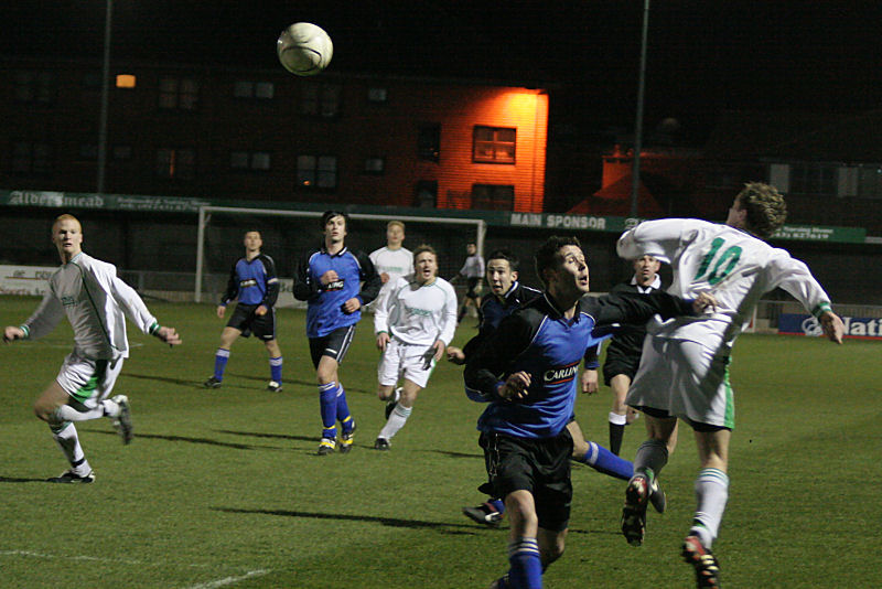 Neil Murfin (10) wins this header across the area

