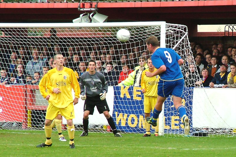 Joe Sheerin heads across goal watched by Hastings Steve Ringwood
