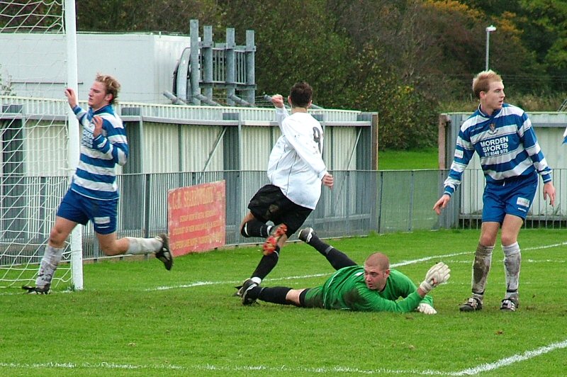 Epsom & Ewell defence beaten for the third goal by Dave Walker
