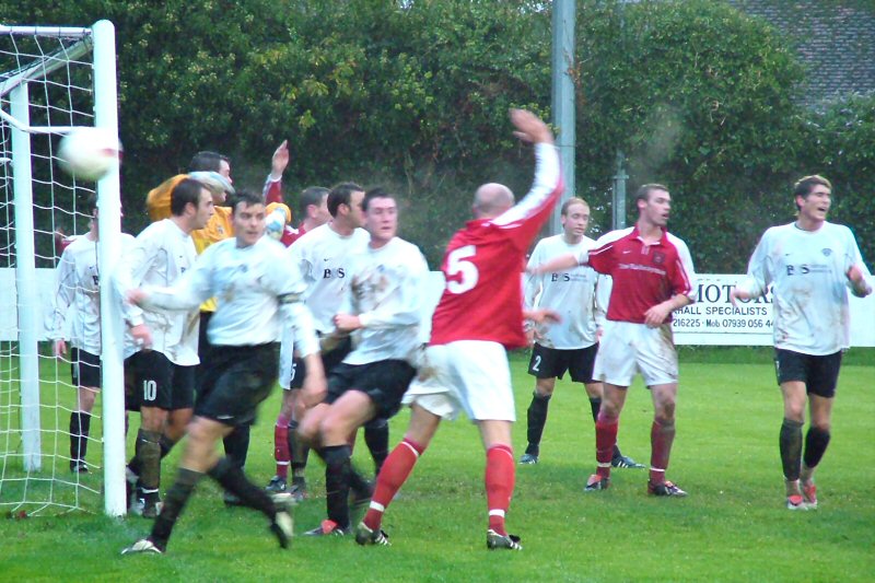 Dave Green (5) appeals for a corner
