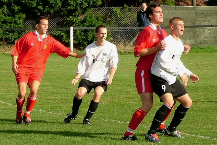 East Preston's Lee Farrell closely marked
