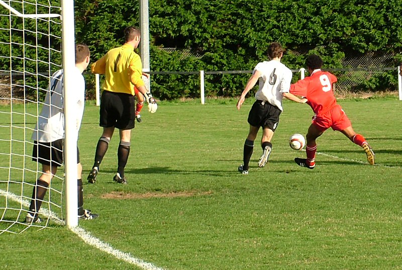 Chris Hall (6) closes down Lee Tunnell
