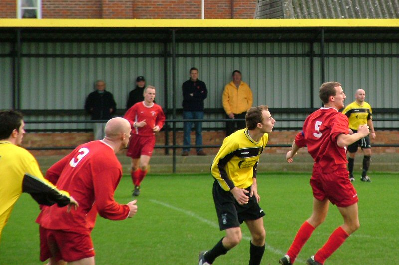 Whitehawk's Stuart Garrod and Andrew Beech and Littlehampton's Grant Vanson
