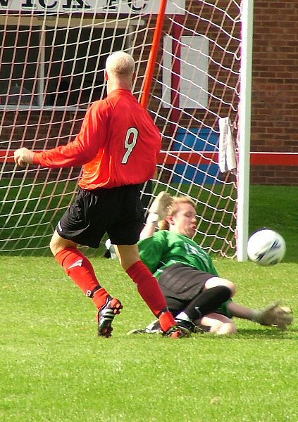 Tom Harvey saves from Kane Evans
