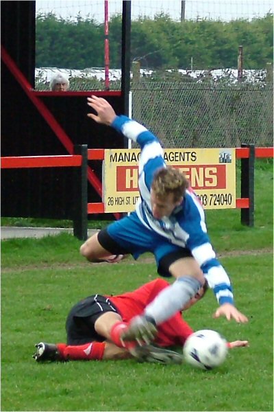 Tom Manton tackles Lee Slade
