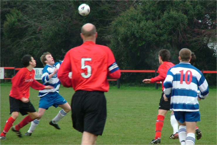 Marc Cooper challenges for the ball watched by Tony Miles (5) and Baz Allen (10)
