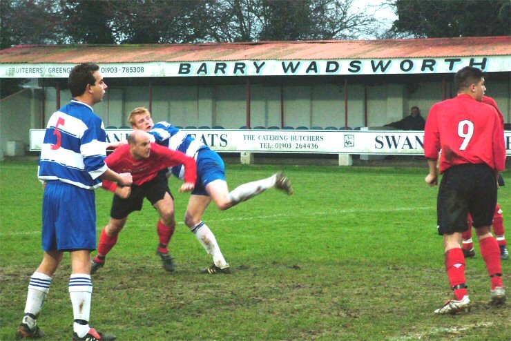 Paul Clarke (5) and Hassan Yassan (9) watch as Tony Miles just beats Dan Jordan to go close with a header
