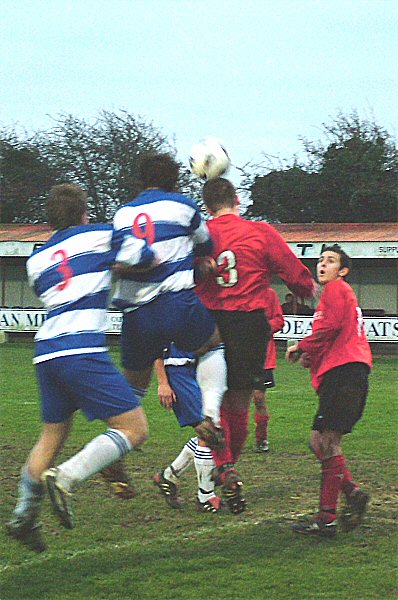 Ricky Mitchell (9) and Lee Howard (3) go for the ball closely watched by David Hawes (3)
