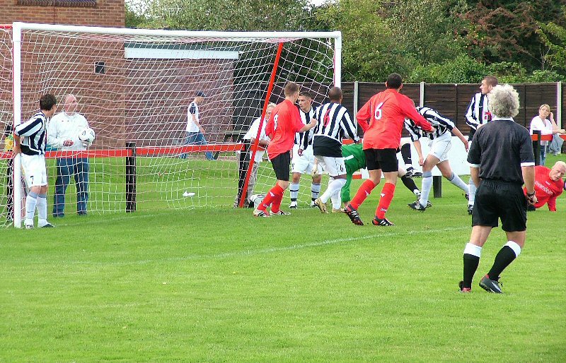 Kane Evans (grounded) finds the net for Wick's first
