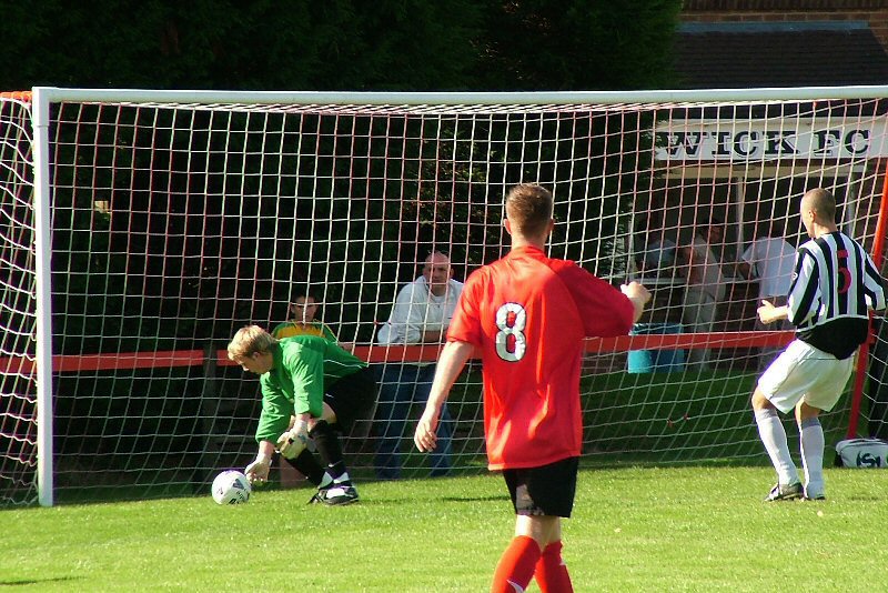 Danny Curd looks on as this shot from Tom Manton (out of picture) beats Harvey
