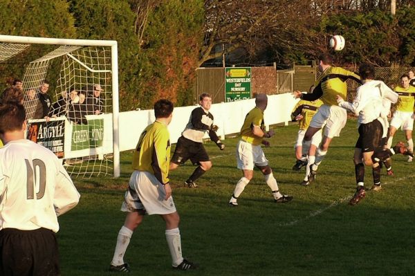 East Preston captain Matt Huckett (10) delivers this free kick into the box 
