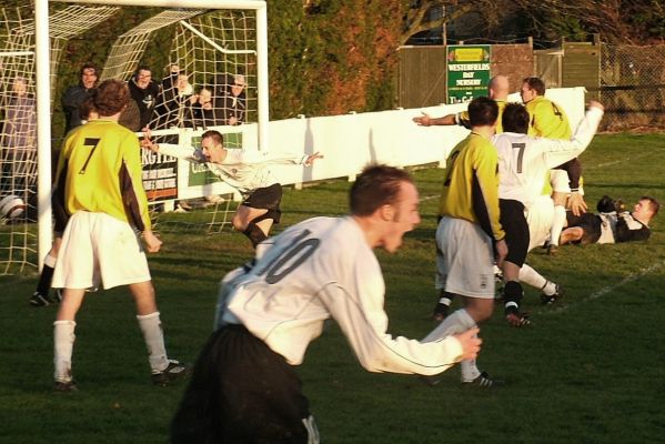 East Preston's Huckett brothers and Chris Hibberd celebrate the first goal 
