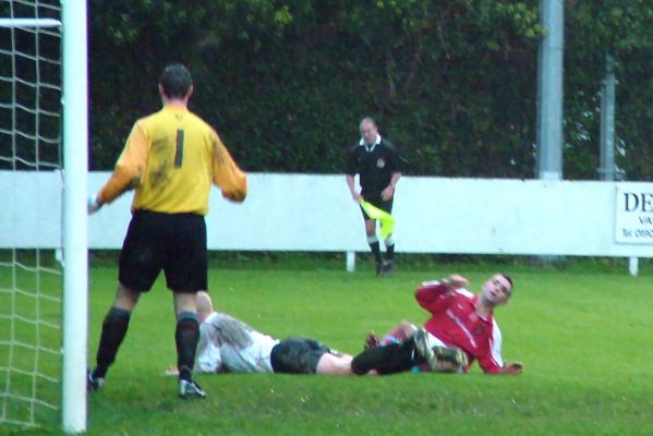 Russell Tomlinson's nicks the ball away from Bradley Ward for a Didcot Town corner
